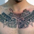 Unfinished black ink chest tattoo of Mayan ancient sculpture