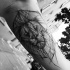 Tatuaggio di testa di leone in inchiostro nero incompiuto di Inez Janiak