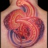 Unique designed colored divided human brain tattoo on upper back with little burning eye
