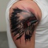 Illustrative style colored shoulder tattoo of Indians helmet