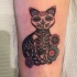 Illustrative style colored arm tattoo of Mexican traditional cat with flowers