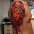 Illustrative style colored shoulder tattoo of large beautiful bird