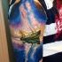 Illustrative style colored shoulder tattoo of old sailing ship