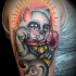 New school style colored shoulder tattoo of maneki neko japanese lucky cat with sun and flowers