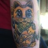 New school style colored arm tattoo of maneki neko japanese lucky cat cat with symbol