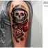 New school style colored shoulder tattoo of space man skeleton with sand clock and planet