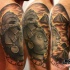 Illustrative style colored shoulder tattoo of stone Mayan statue with big temple