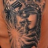 Unusual combined old mechanical clock with woman face tattoo on shoulder