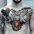 Unusual combined realistic owl tattoo on chest with human heart and moon