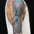 Tatuaje en el brazo, mitad elefante mitad pulpo exclusivo extraño