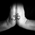 Usual black ink Hinduism symbol tattoo on hands