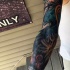 Tatuaje en el brazo completo, cosmos misterioso extraordinario
