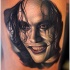 Very detailed natural looking Crow movie hero tattoo on thigh