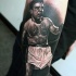 Tatuaje  de retrato de boxeador  en el antebrazo