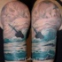 Vintage picture like shoulder tattoo of sailing ship in stormy sea