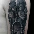 Vintage style black ink shoulder tattoo of old medieval town with gates