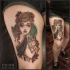 Vintage style colored thigh tattoo of seductive woman with cat