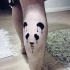 Watercolor style beautiful looking leg tattoo of panda bear figures
