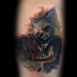 Watercolor style colored leg tattoo of movie raccoon warrior