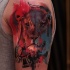 Watercolor style colored shoulder tattoo of lion head with clock