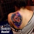 Watercolor style colored shoulder tattoo of lion head