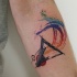Watercolor style forearm tattoo of triangle and circle