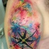 Watercolor style interesting looking colored shoulder tattoo of of nautical compass and date