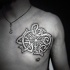 White ink colored chest tattoo of Celtic ornaments