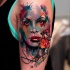 Wonderful colored watercolor style abstract woman portrait tattoo on shoulder combined with small bird