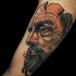wonderful looking colored biceps tattoo of creepy mans portrait