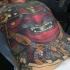 Tatuaje en la espalda, máscara roja masiva de samurái