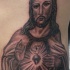 Tatuaje de jesús en las costillas