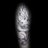 Wooden like black ink arm tattoo of creepy Panda bear with horns