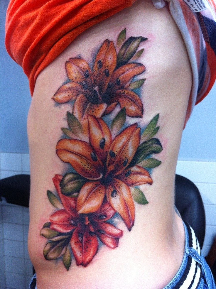 Tiger lily tattoo on ribs