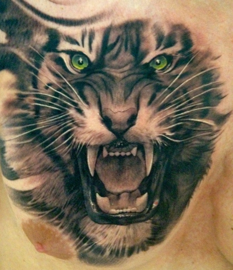 Black tiger with green eyes roar tattoo