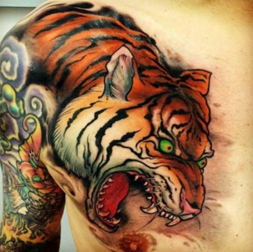 Asian style tiger tattoo on shoulder and chest
