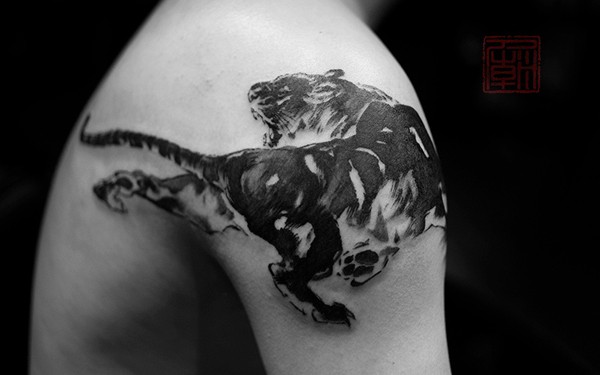 Black tiger tattoo on shoulder