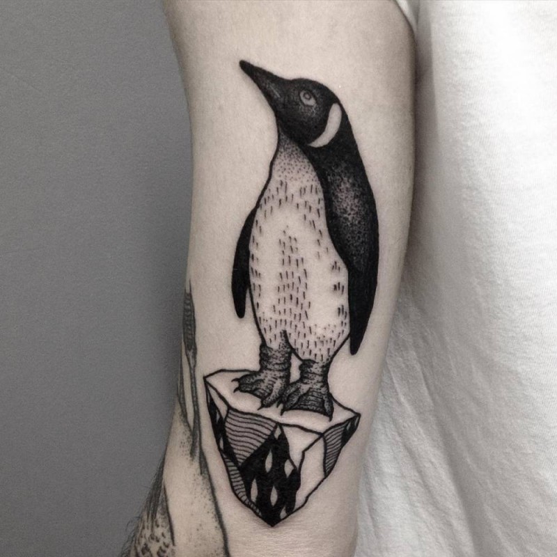 Tiny black and white cute pigeon tattoo on arm
