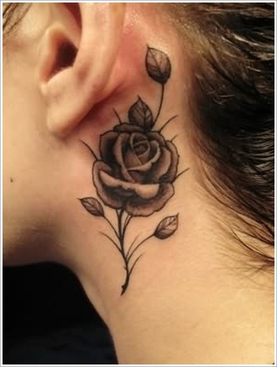 Tiny black ink rose flower tattoo on neck