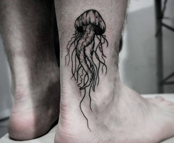 Tiny black ink simple jellyfish tattoo on ankle