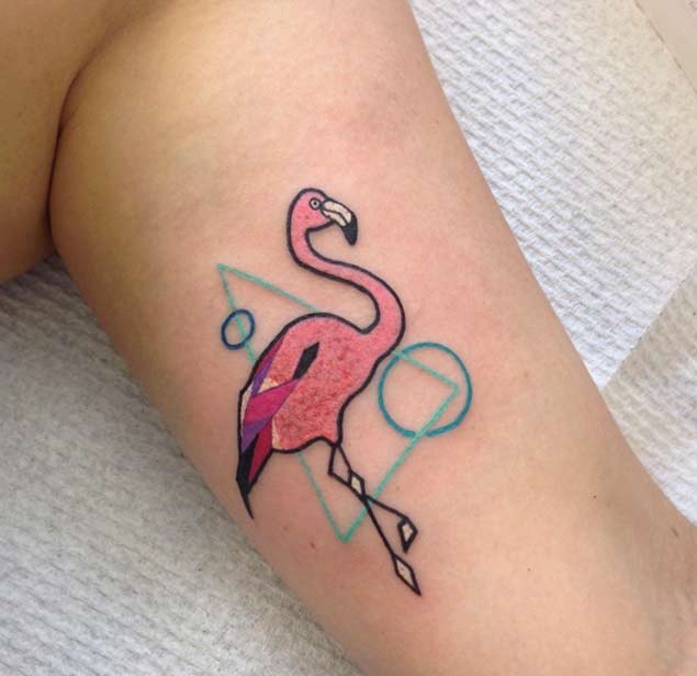 Tiny cartoon like painted flamingo tattoo combined with geometrical figures
