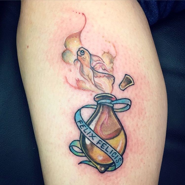 Tiny cartoon style colored magical bottle with lettering tattoo