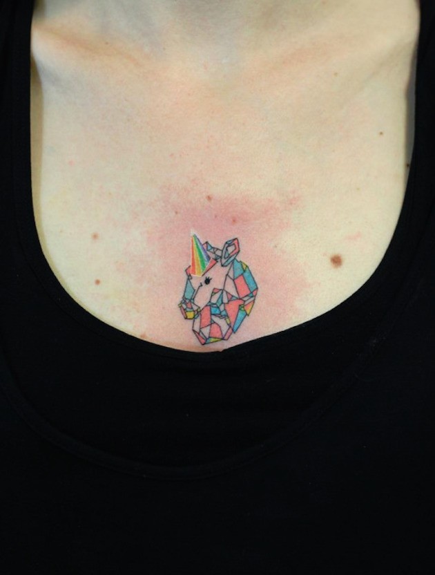 Tiny homemade like abstract tattoo on chest