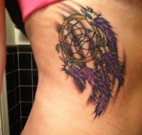 Tiny simple designed colored side tattoo of dream catcher