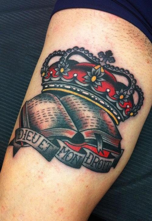 Traditional style crown tattoo with script
