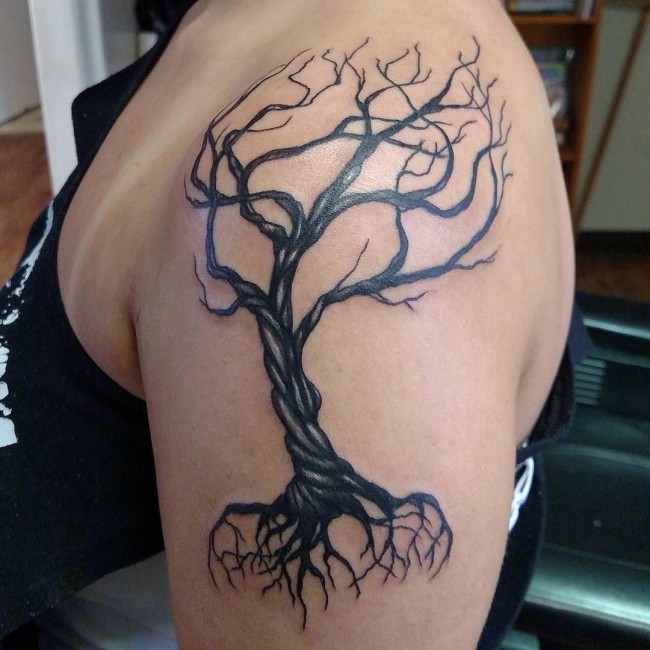 Tree without leaves with long roots shoulder tattoo