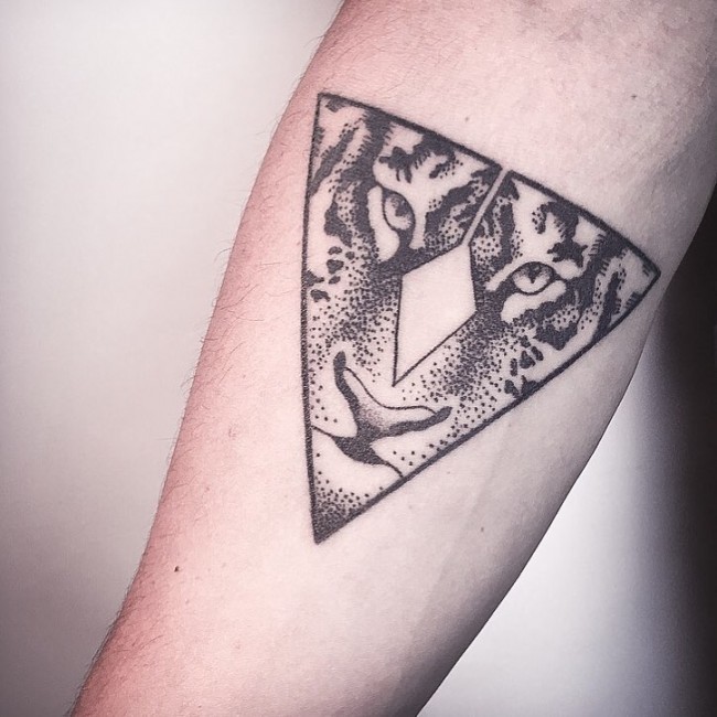 Triangle shaped black ink forearm tattoo stylized with tiger face