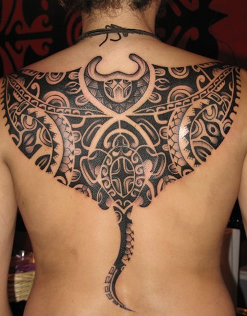 Tribal black ink art tattoo on upper back