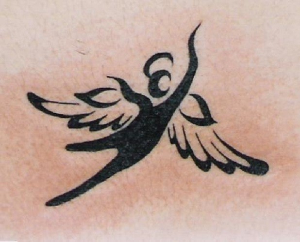 Tribal flying angel tattoo