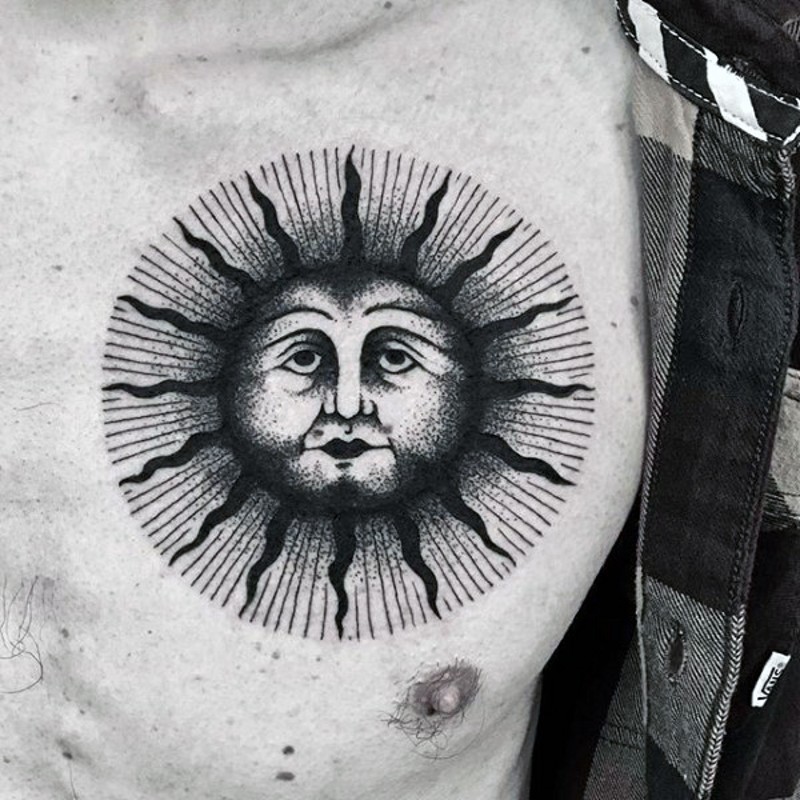 Tribal style big black and white sun tattoo on chest